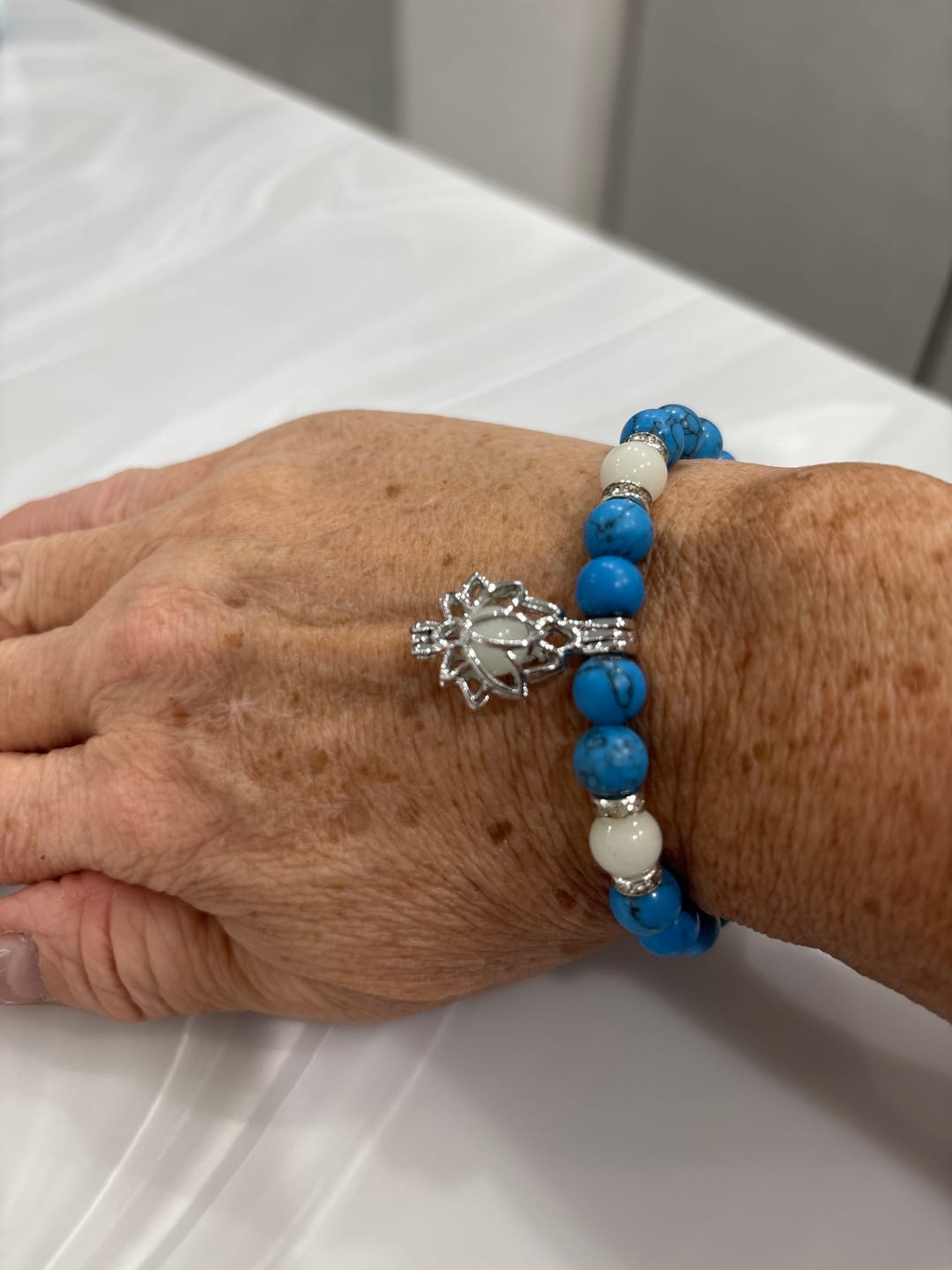 Customer photo review of Buddha Stones Tibetan Turquoise Glowstone Luminous Bead Lotus Protection Bracelet