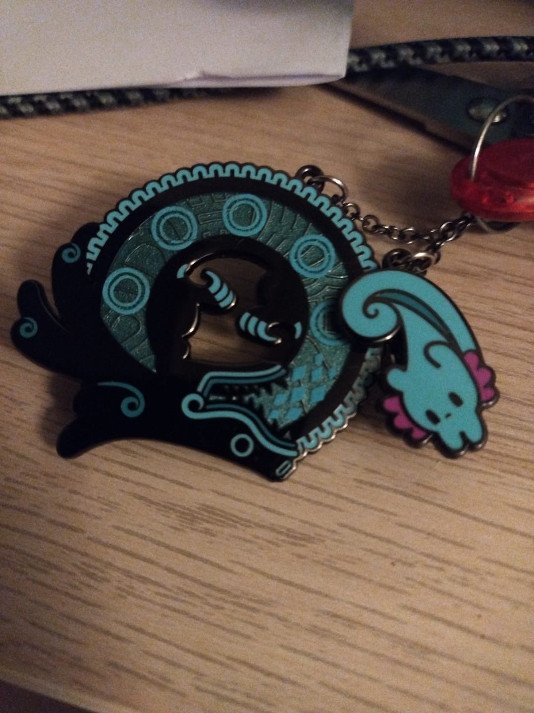 Customer photo review of Rain World - Cyan Lizard Hanger Pin