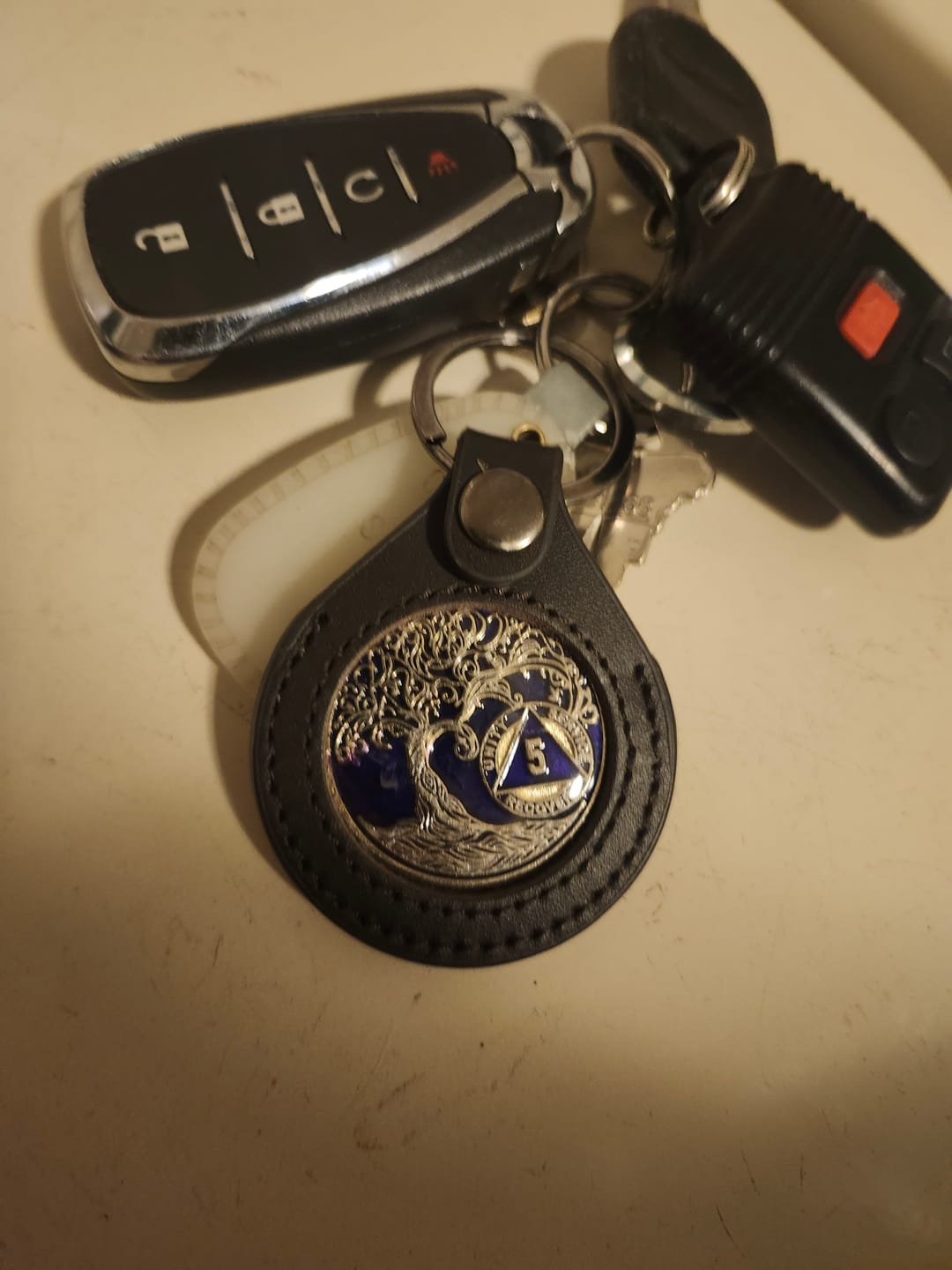 Customer photo review of Sobriety Mint Genuine Leather 40mm AA Medallion Keychain Holder - Recovery Chip/Coin/Token Holder - Black