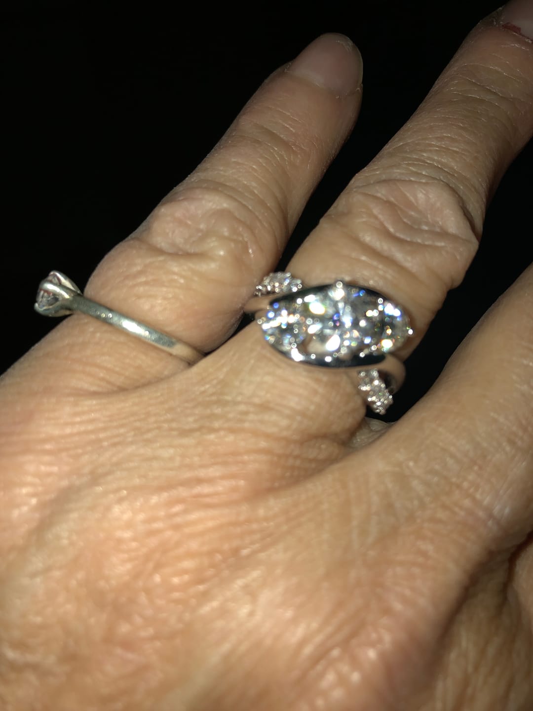 Customer photo review of Swirl Three Stone Moissanite Twisted Pave Engagement Ring