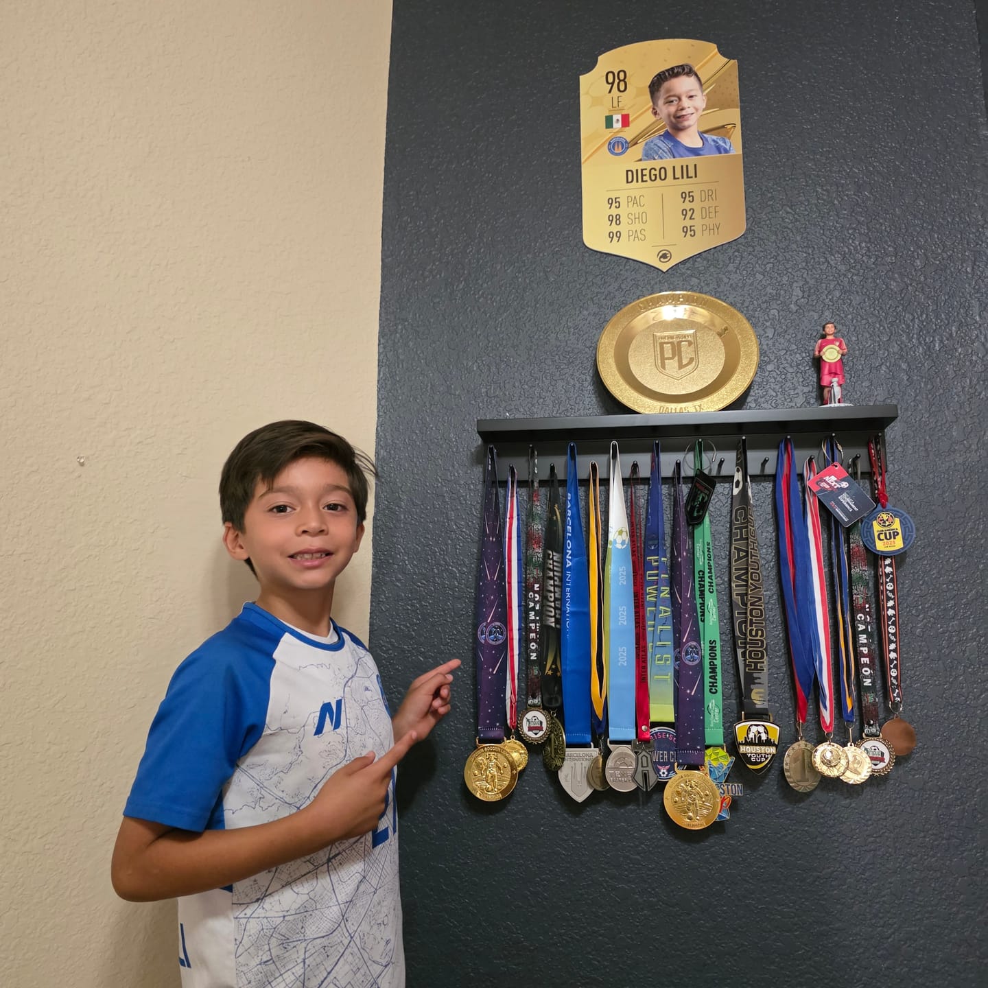 Customer photo review of 2ft Medal Awards Rack Premier Trophy Shelf- Trophy, Plaque and Medal Display