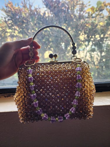 Customer photo review of Short Purse Lei- Purple Crown Flower & Pakalana