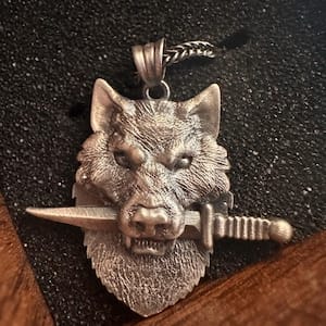 Customer photo review of Wolf Knife Pendant