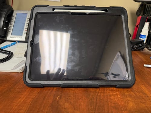 Reviewer's iPad Pro 13" in the secure Raider Series case, which has a built-in screen protector, on a desk.