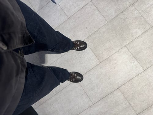 Customer's top-down view of the indigo Straight-Fit Jeans, showing the fit from the waist down.