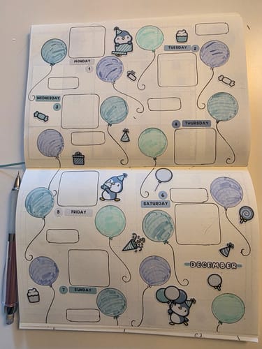 Customer's journal showing a weekly layout decorated with cute Party Penguins stickers from their Ultimate Subscription.