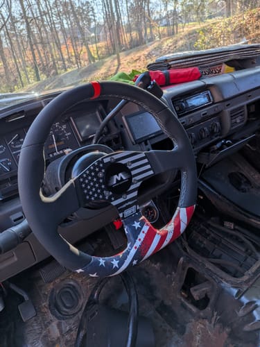 Customer's Motion Quick Release Hub installed in a 93 Bronco, connecting an American flag-style steering wheel to the column.
