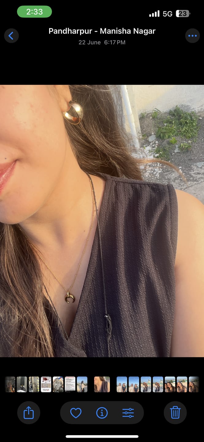 Customer photo review of Tiny Horn Necklace