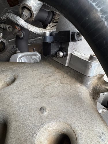 Customer's close-up of the SPE Motorsport MAP Sensor Spacer/Relocator installed on the truck's silver intake manifold.