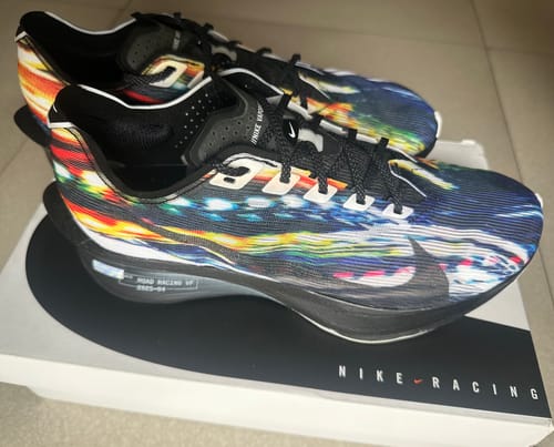 Customer's vibrant, multicolored Nike Vaporfly 4 shoes displayed on the shoebox.