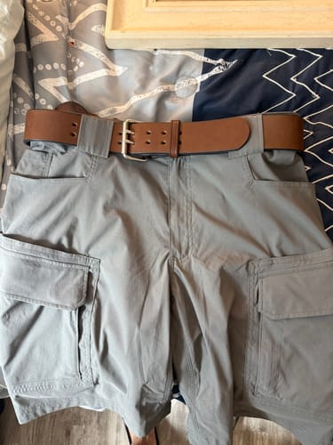 Customer's brown Marshall belt with a double-prong buckle, threaded through grey cargo shorts.