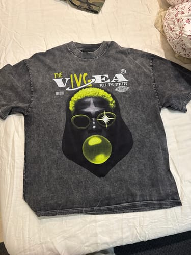 Customer's washed Street Retro Creative Print T-shirt laid out, showing the large neon graphic.