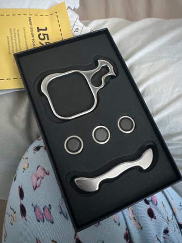 Reviewer showing the silver metal components for the EdgeGuard Ultra in its black packaging.