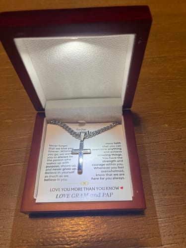 Reviewer's Artisan Cross Gift Set in the open, lit presentation box, showing the necklace and message card.