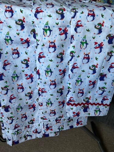 Customer's finished pyjama bottoms sewn from the Christmas Penguins on White Polycotton Fabric.
