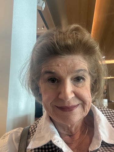 Reviewer's close-up portrait showing a smoother facial appearance after using the Deep Collagen Cream.