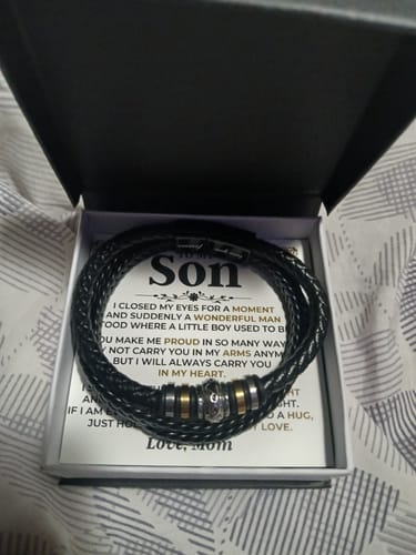 Reviewer's 'Love You Forever' bracelet gift set. The black braided bracelet sits inside the box on top of the message card.