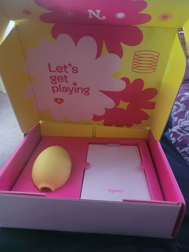 Customer's Tutti Frutti Bundle box, open to show the yellow Lem toy in its bright pink insert.