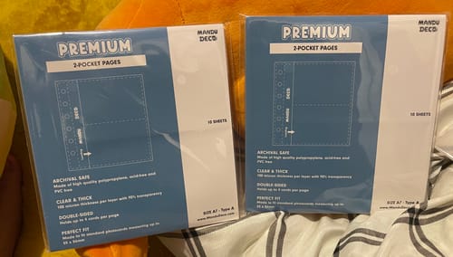 Customer's two unopened packs of CUSTOM A7 POCKET PAGES in their original blue and white packaging.