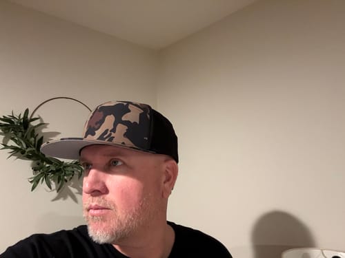 Customer's side view of the Big Flat Bill Structured Watersport Hat, showing the black mesh panel.