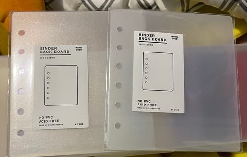 Customer's two sets of A7 Binder Backboards in packaging. One set is sparkly clear and the other is frosted clear.