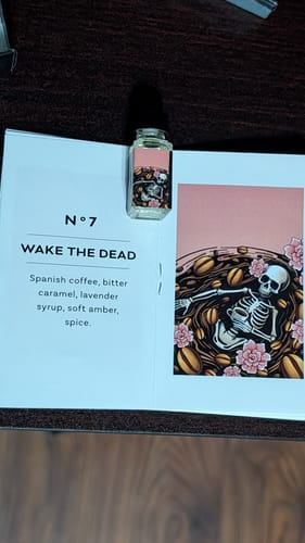 Reviewer's sample bottle of Wake The Dead fragrance in its Halloween advent calendar card with skeleton artwork.