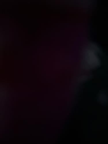 Close-up: Reviewer's dark and blurry image of the Candy Heart Charms.