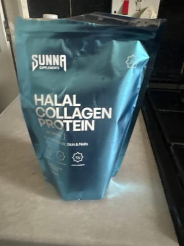 Customer's opened blue pouch of Halal Collagen Protein sitting on a kitchen counter.