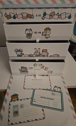 Customer's Holiday Happy Mail Advent Calendar box, showing the cute, illustrated drawers and several mail-themed stationery items.