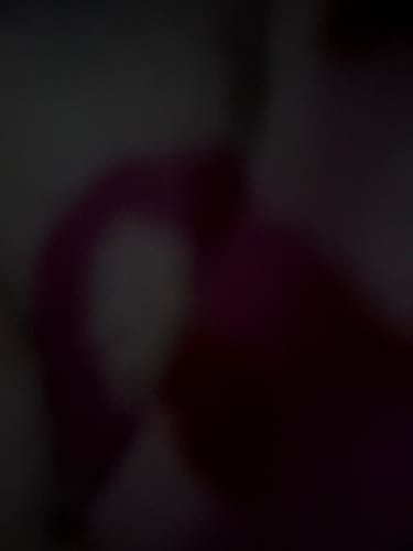 Close-up: customer's blurry, dark photo of the I Love You Bracelet.