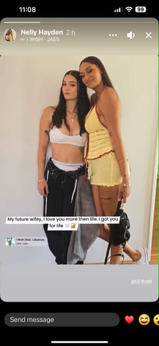 A reviewer's photo of two people dressed for a social event.