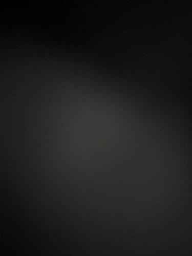 Reviewer's dark, unclear photo where no product is visible.