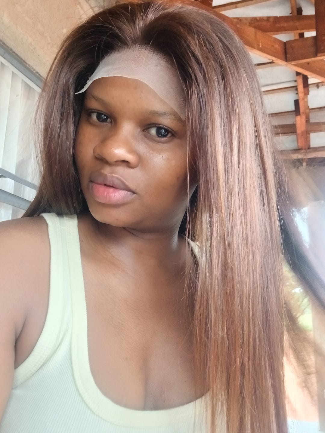 Customer photo review of Glueless Dark Brown Peruvian Straight Wig