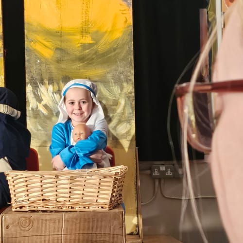 Customer review image of a child in costume. The Lace-Trimmed Velvet A-Line Dress is not pictured.