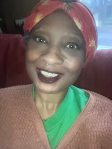 A customer smiles in a close-up shot, wearing the Three Tone HONEY Brown prescription contact lenses.