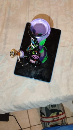 Customer's top-down view of the colorful Journey To The Stars bong, showing its peace sign design.
