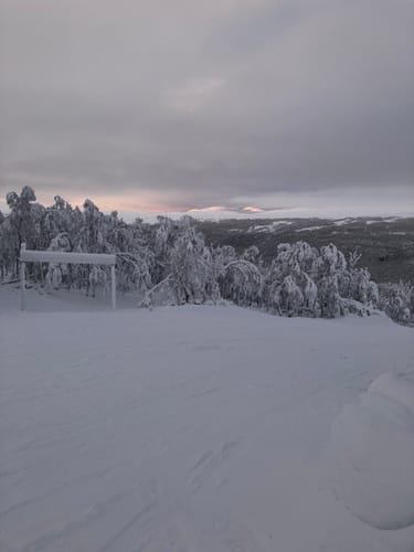 Customer's view of a snowy mountain in Sweden, the setting mentioned in their review for the SPOTMINDERS Tracking Card.