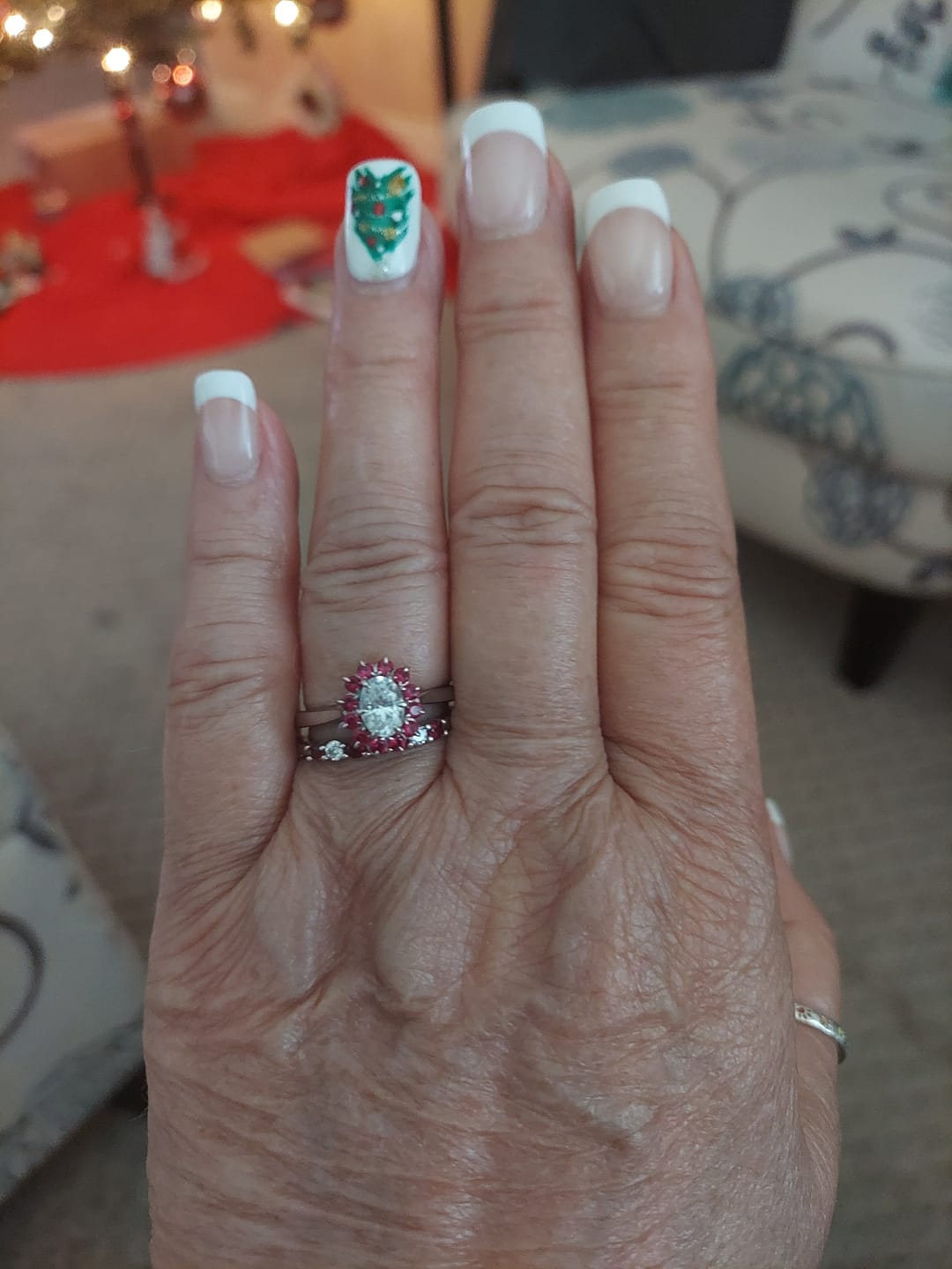 Customer photo review of Oval Moissanite With Floral Ruby Halo Engagement Ring
