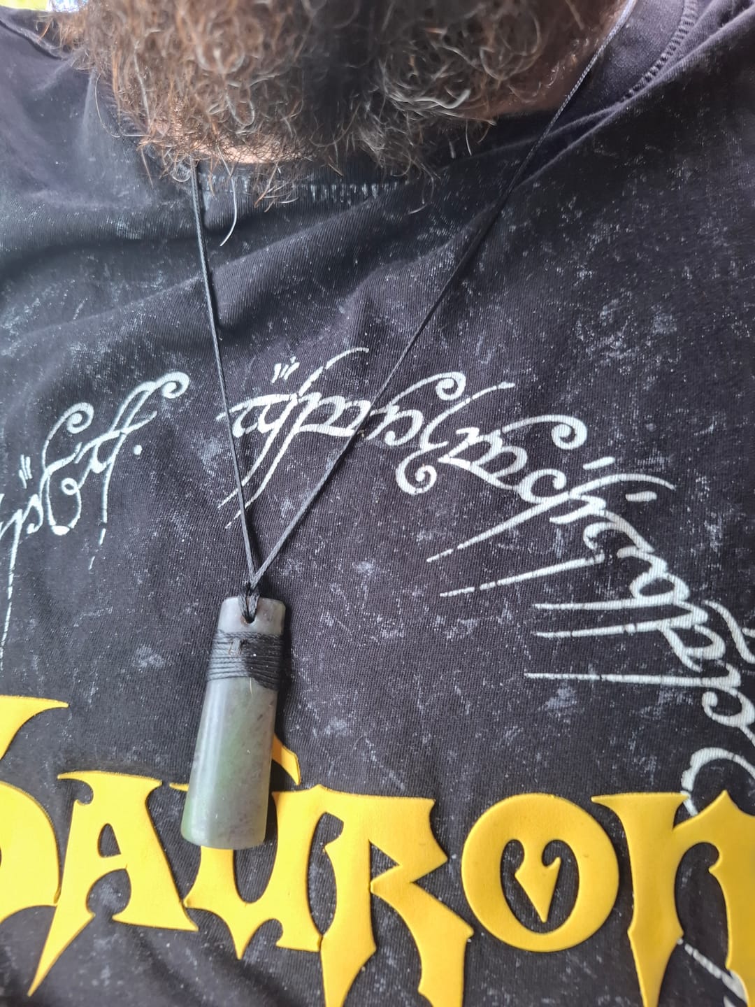 Customer photo review of Genuine Ngai Tahu Pounamu Wrapped Greenstone Toki Necklace 6cm