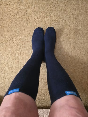 Customer's view looking down at their legs while wearing the dark Performance Eucalyptus Compression Socks.