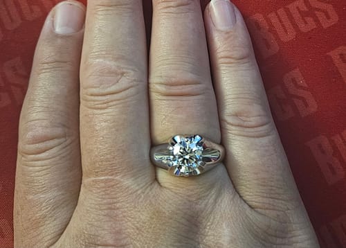 Customer's hand wearing the large 3 Carat Big Diamond Solitaire Men Ring in white gold.