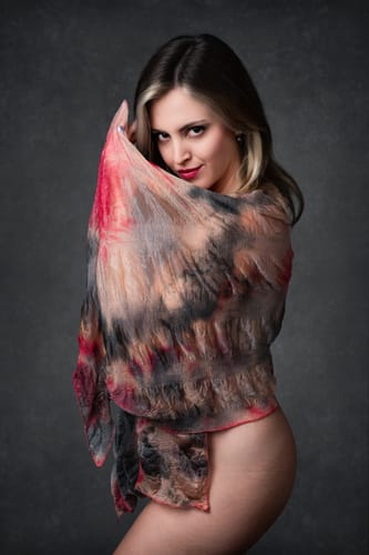 Customer's portrait edited with Evoto Femme Model Presets, showing a person wrapped in a colorful, sheer scarf.