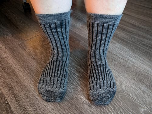 Customer wearing the stone grey Joey Crew Socks, showing the ribbed texture from the front.