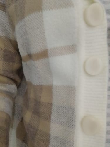 Reviewer's close-up of a plaid shirt worn with the Anushka Sharma Silver Queens Necklace, which is not visible.