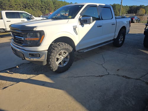 Customer's white Ford F150 with a raised stance after installing the 3 inch Front Leveling Lift Kit.