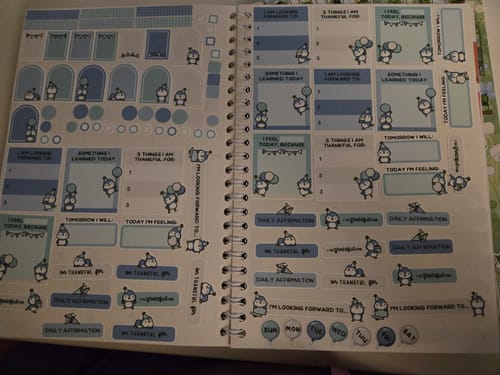 Customer's Gratitude Prompts Party Penguins sticker sheet displayed across two pages of a spiral-bound planner.
