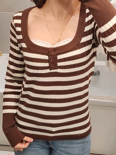 Reviewer wearing the Lumière Milk Cocoa Brown Sweater, showing the striped pattern and lace cami at the scoop neck.