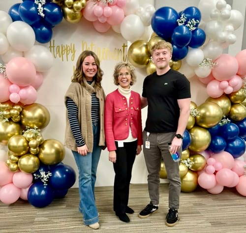 Reviewer wearing the stylish Disco Dream Trouser Flare Jeans with a vest and striped shirt at an event.