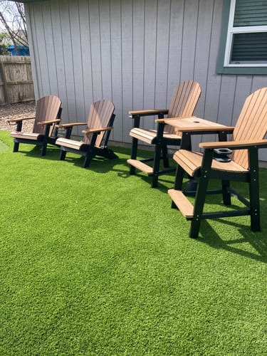 Customer's set of four two-tone Folding Adirondack Chairs on a backyard putting green.