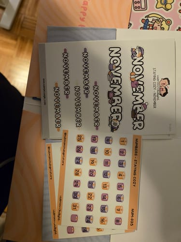 Customer's 'Staying Cozy' planner sticker sheets for November, including cute month titles and colorful date number stickers.
